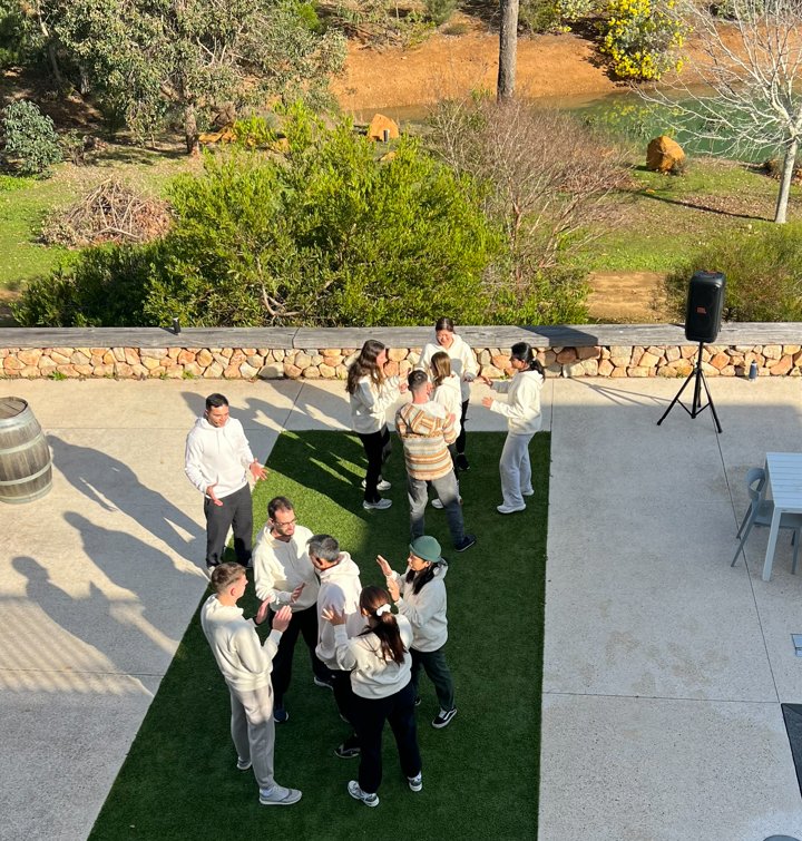 Cohort in an outdoor movement exercise on the retreat lawn