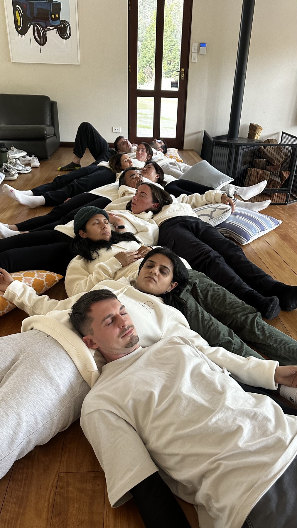 Trainees resting in savasana together after a breathwork journey